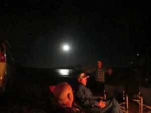 The full moon competed for attention around the campfire. 